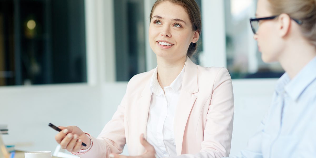 Woman in interview smiling and using hands